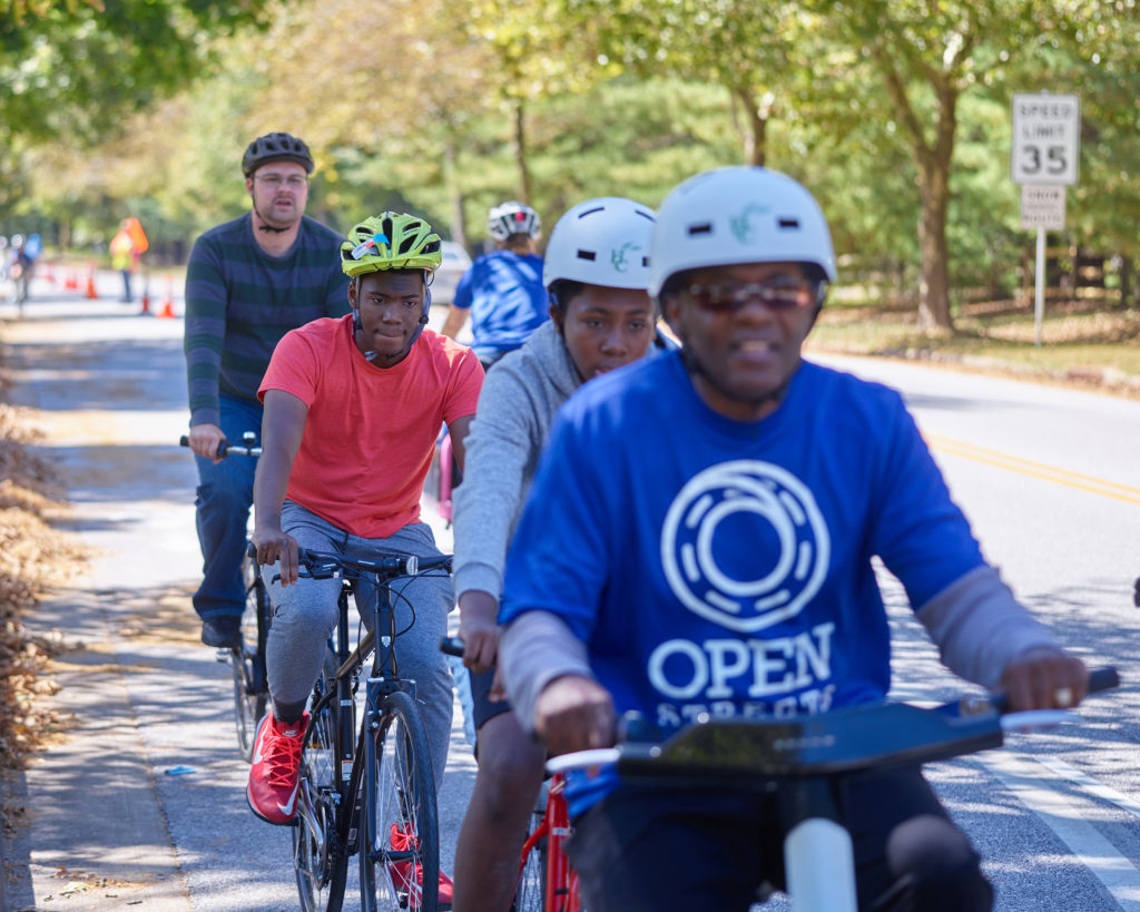 People bicycling