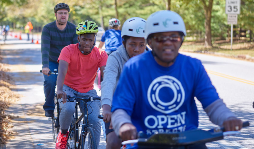 People bicycling